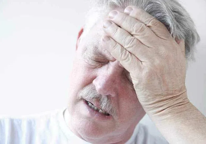 Whiplash & Auto Accidents 10 a man with headache due to whiplash injury in Columbus Ohio